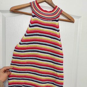 High neck, sleeveless top.